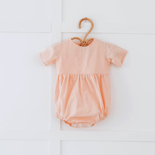Peach romper with short sleeves