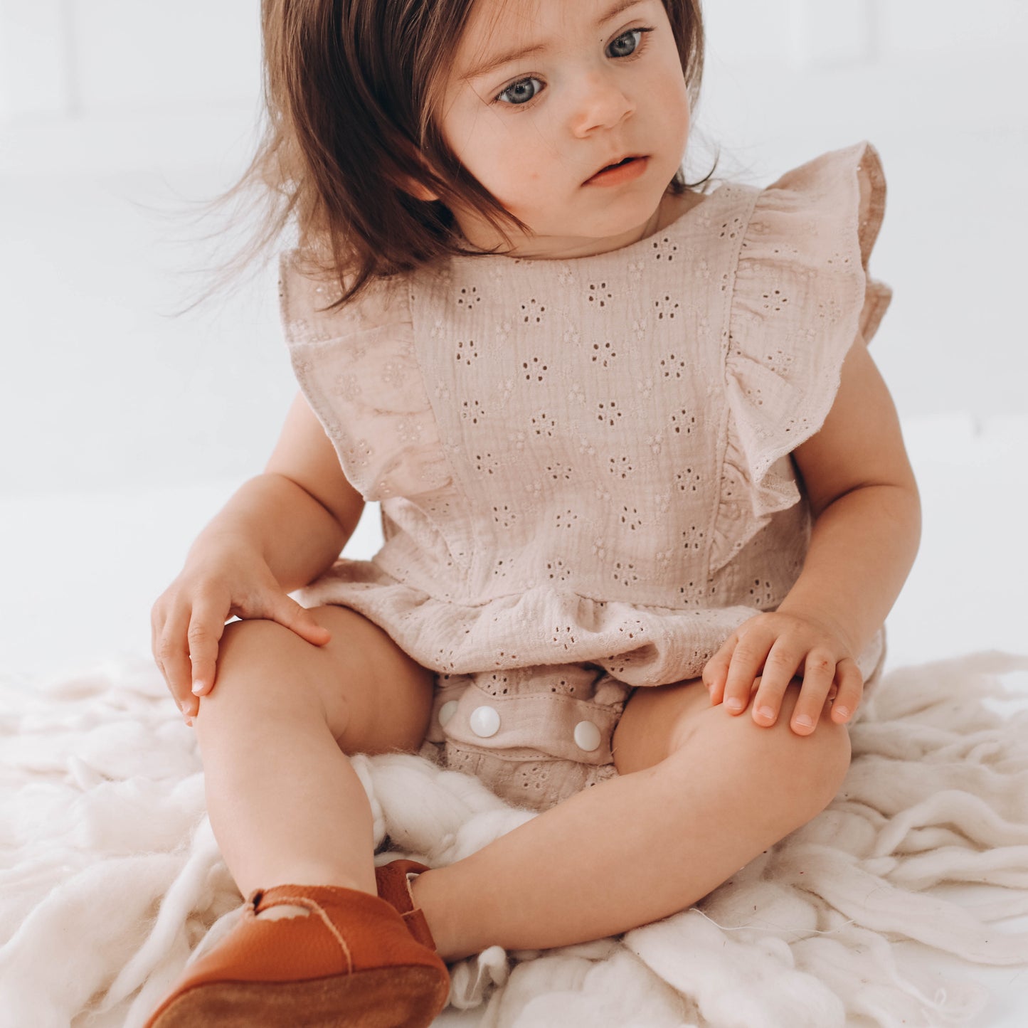 Embroidered muslin romper with frills